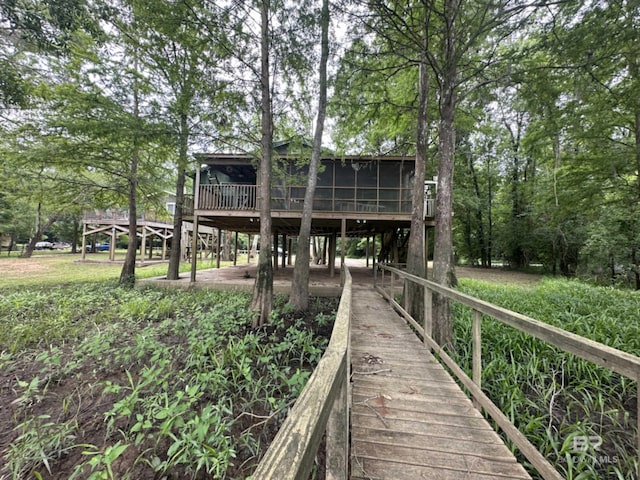 rear view of house with a sunroom