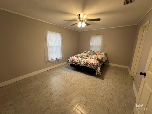 bedroom featuring ceiling fan and ornamental molding