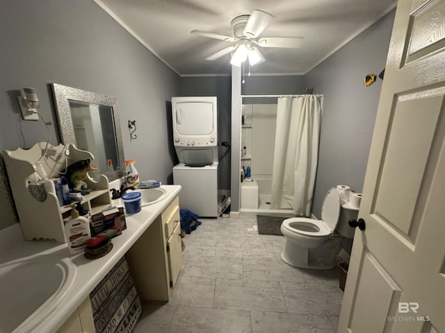 bathroom with vanity, a shower with shower curtain, ceiling fan, ornamental molding, and stacked washer / dryer