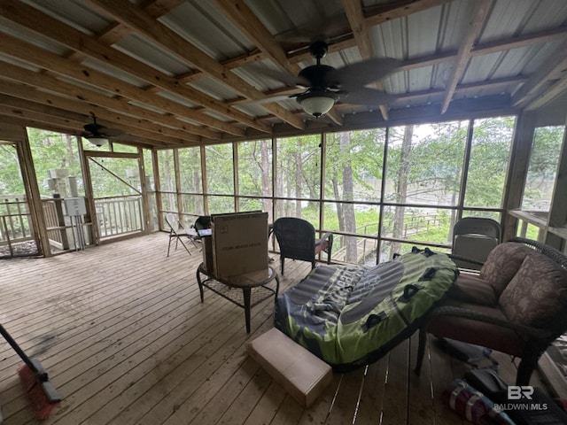 sunroom with plenty of natural light and ceiling fan