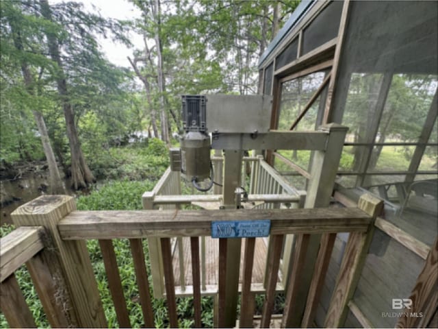 wooden deck featuring a sunroom