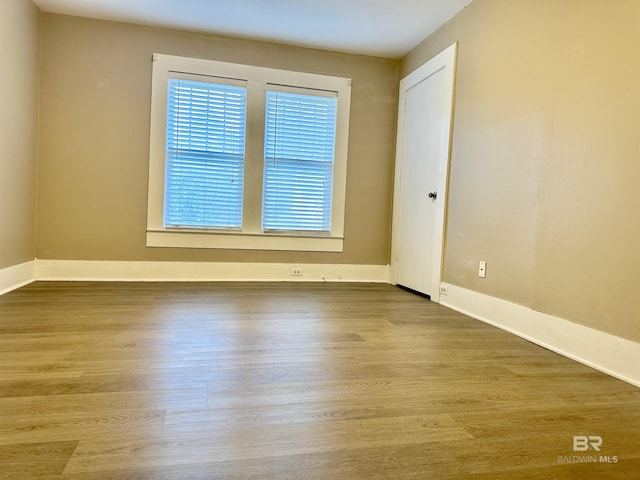 spare room with hardwood / wood-style flooring