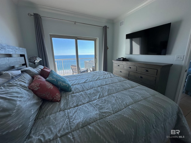 bedroom featuring access to outside, visible vents, and ornamental molding