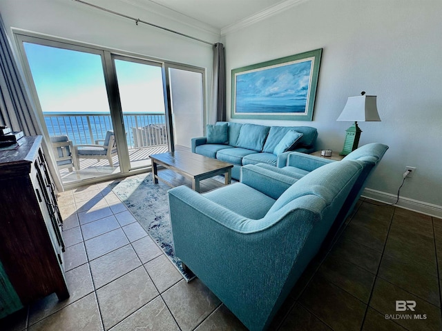 tiled living area featuring crown molding, baseboards, and a water view