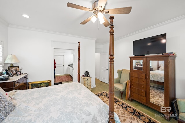 bedroom featuring ceiling fan, ornamental molding, and carpet