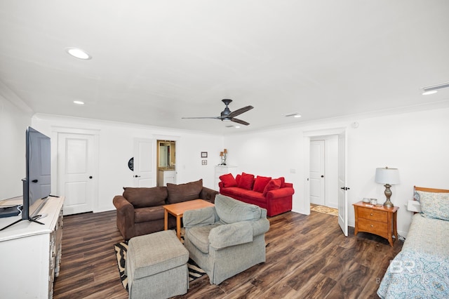 living room featuring dark hardwood / wood-style flooring, ceiling fan, and ornamental molding