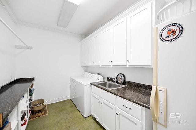 laundry area with ornamental molding, sink, cabinets, and independent washer and dryer