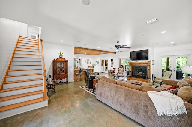 living room with ceiling fan, concrete flooring, french doors, and a wealth of natural light