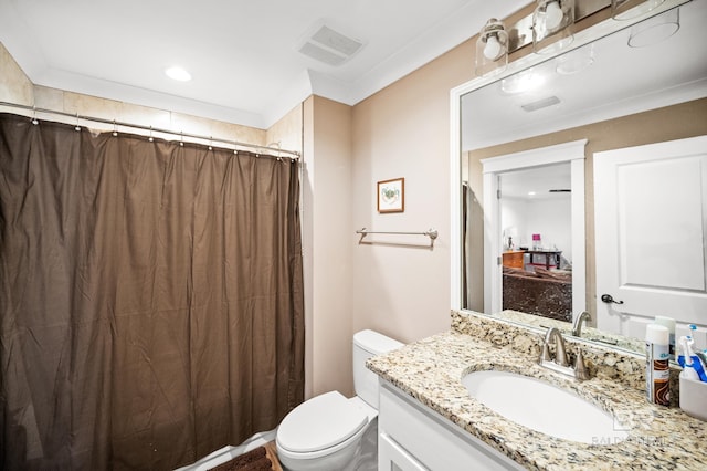 bathroom featuring toilet and vanity