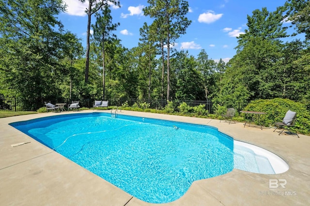 view of pool featuring a patio