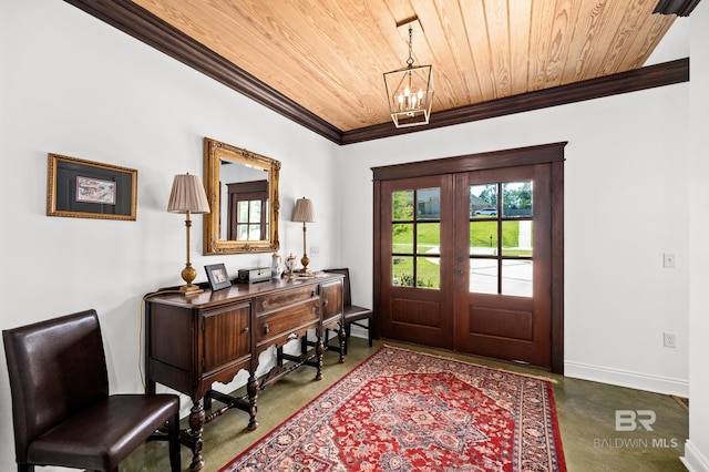 entrance foyer featuring french doors, ornamental molding, concrete flooring, wood ceiling, and a chandelier