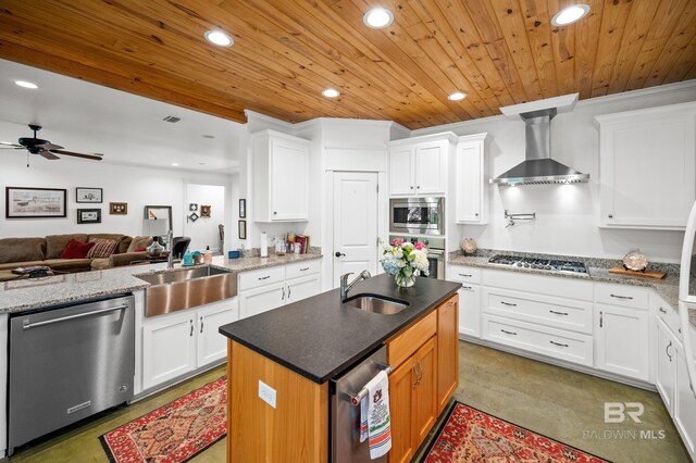 kitchen featuring appliances with stainless steel finishes, sink, and white cabinetry