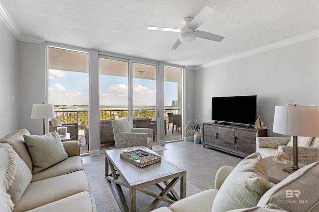 tiled living room featuring floor to ceiling windows, ceiling fan, a textured ceiling, and crown molding