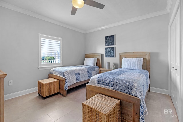 bedroom with ceiling fan, light tile patterned floors, a closet, and ornamental molding