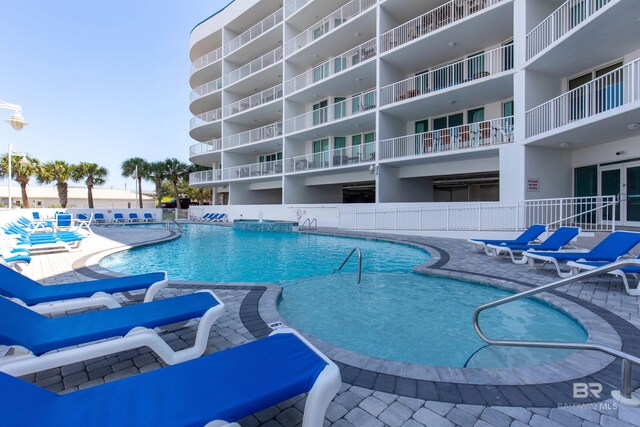 view of swimming pool featuring a patio area