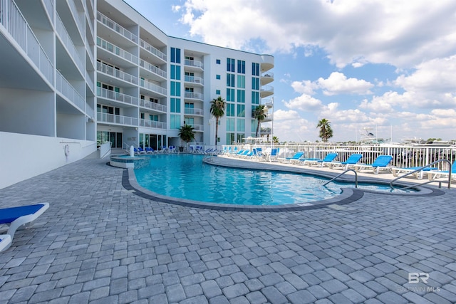 view of swimming pool featuring a patio