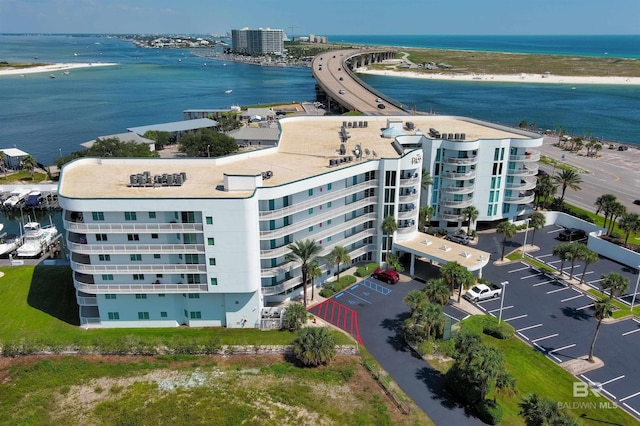 birds eye view of property with a beach view and a water view