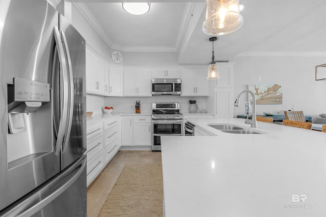 kitchen featuring pendant lighting, light tile patterned flooring, sink, white cabinets, and stainless steel appliances