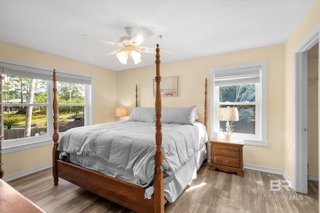 bedroom featuring ceiling fan and light hardwood / wood-style flooring