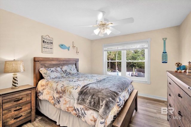 bedroom featuring ceiling fan and light hardwood / wood-style flooring