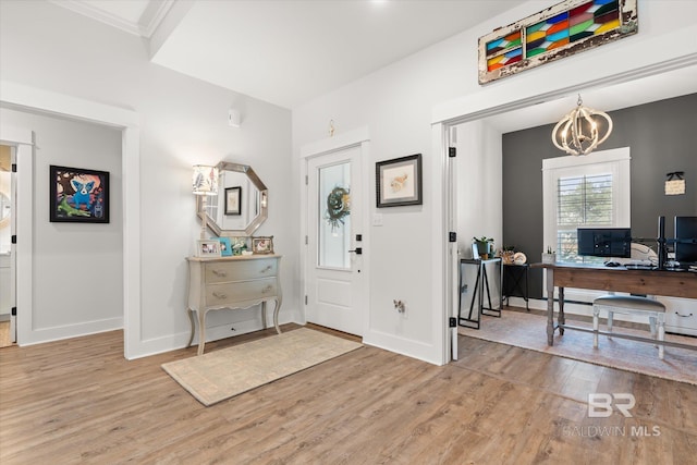 foyer with a notable chandelier and wood-type flooring