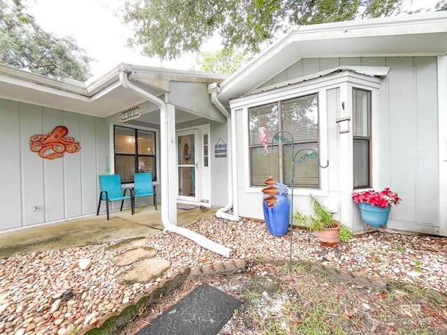 entrance to property featuring a patio area