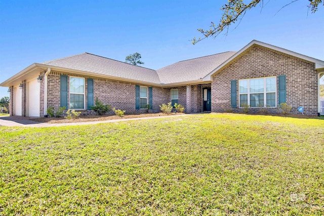 ranch-style home with a front yard, a garage, brick siding, and a shingled roof