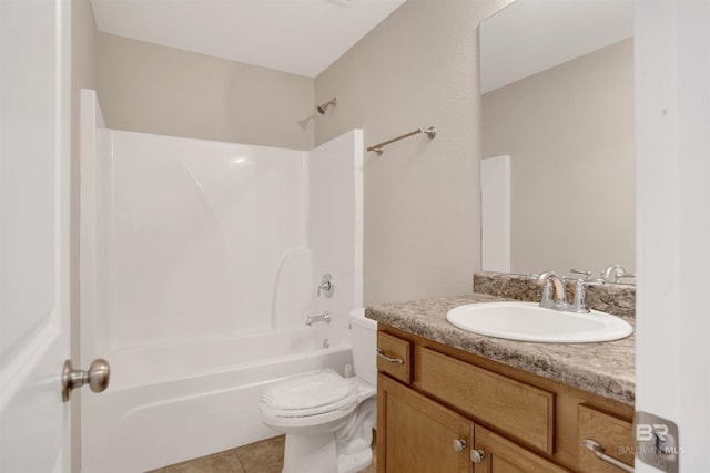 bathroom with tile patterned floors, toilet, vanity, and washtub / shower combination