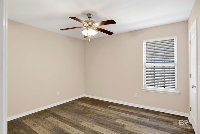 empty room with a ceiling fan, baseboards, and dark wood-style flooring