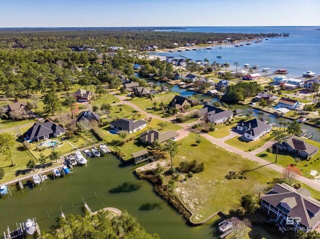 bird's eye view with a water view and a residential view