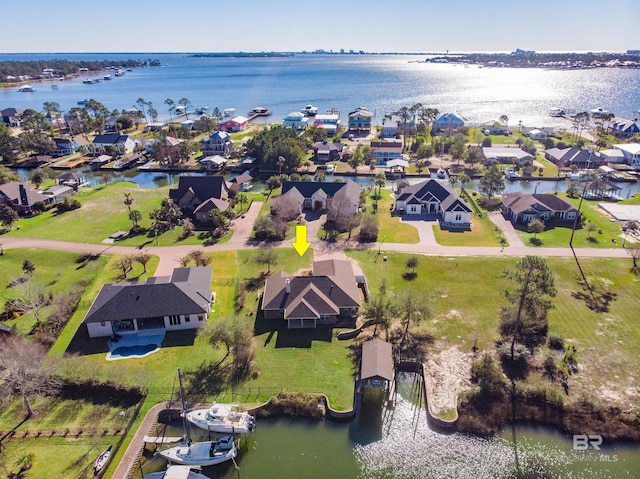 bird's eye view featuring a residential view and a water view