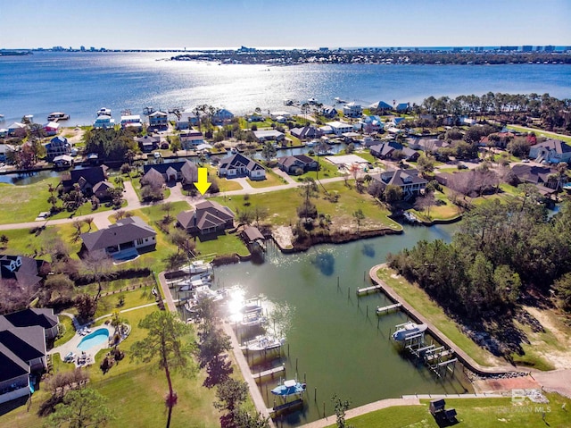 bird's eye view featuring a residential view and a water view