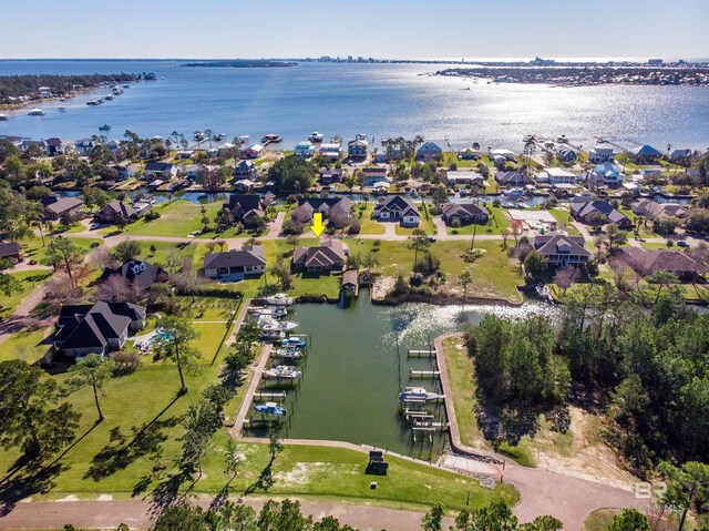 aerial view with a water view and a residential view