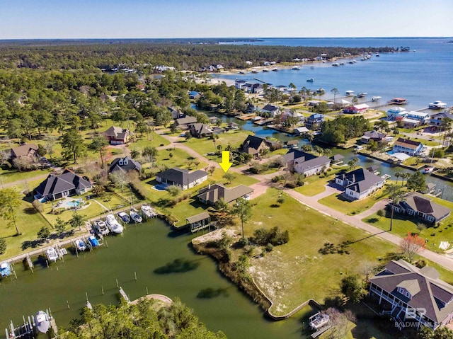 bird's eye view featuring a residential view and a water view