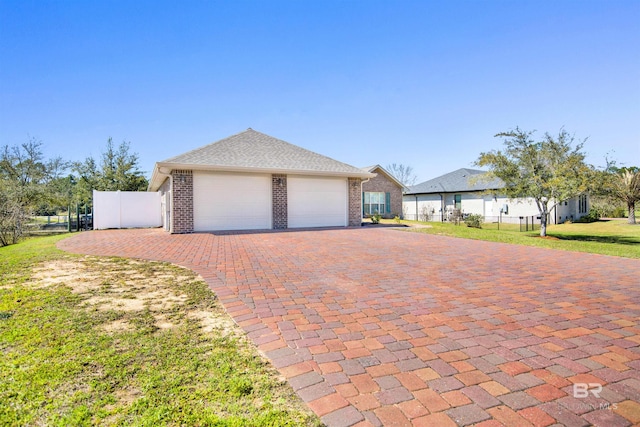 garage with fence