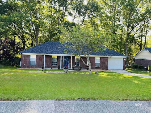 single story home featuring a front yard, brick siding, a garage, and concrete driveway
