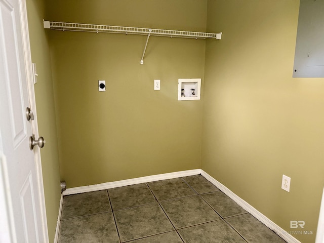 laundry room featuring laundry area, hookup for a washing machine, hookup for an electric dryer, dark tile patterned floors, and baseboards