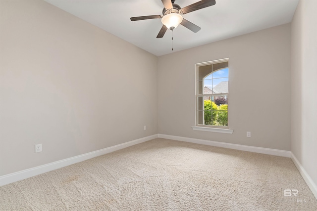 empty room featuring carpet and ceiling fan