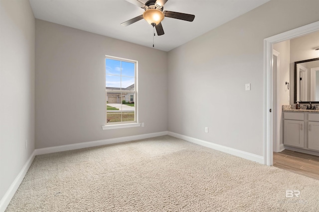 carpeted empty room with ceiling fan