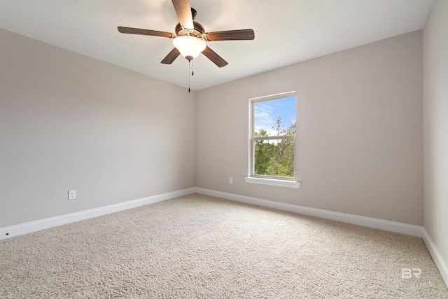 carpeted empty room with ceiling fan