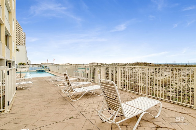 view of patio with a community pool