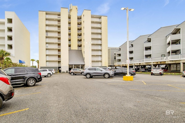 view of building exterior featuring uncovered parking