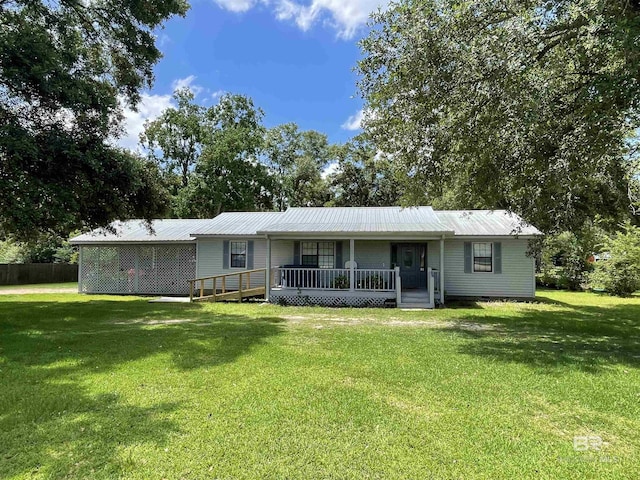 ranch-style home featuring a porch and a front yard