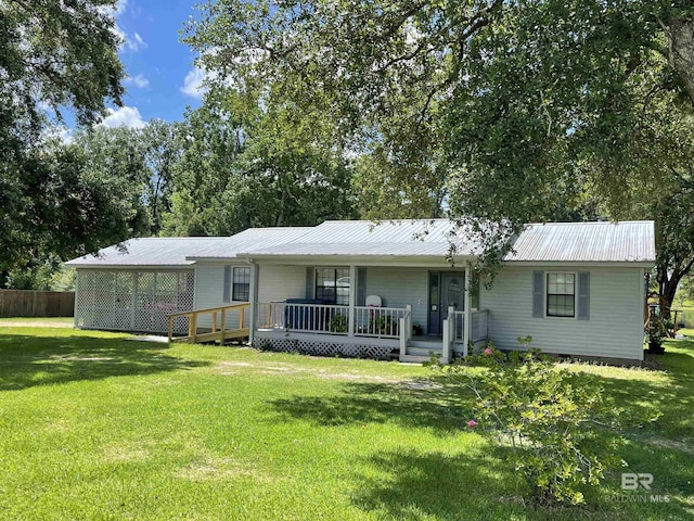 back of house with a lawn