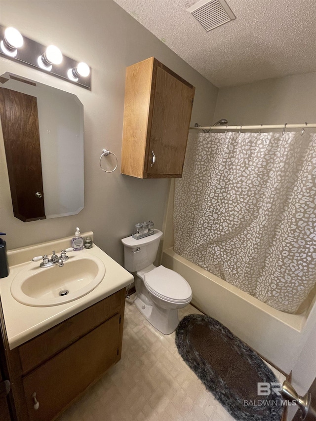 full bathroom featuring toilet, a textured ceiling, shower / bath combination with curtain, and vanity