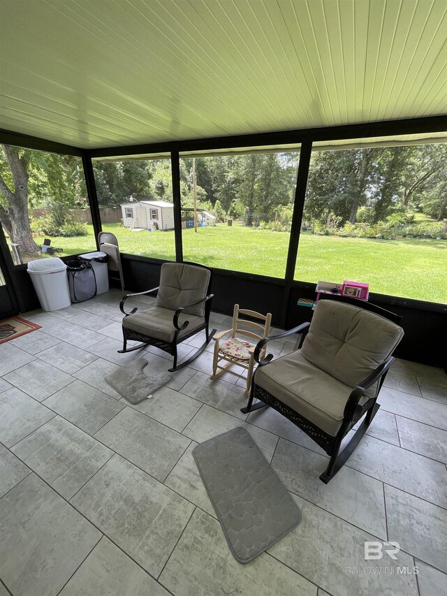 sunroom with wooden ceiling