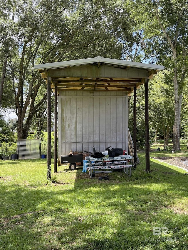 view of outbuilding featuring a lawn