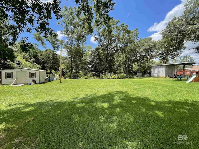 view of yard with a storage unit