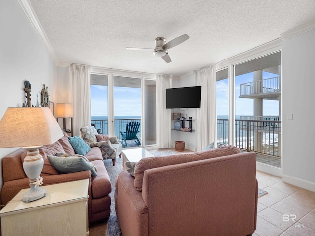 375 Beach Club Trl Unit A1710, Gulf Shores, AL 36542 - living area featuring crown molding, ceiling fan, a textured ceiling, and light tile patterned flooring