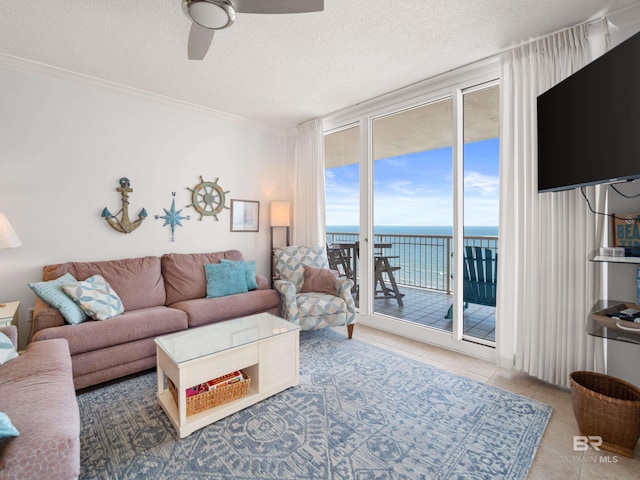 375 Beach Club Trl Unit A1710, Gulf Shores, AL 36542 - tiled living room featuring expansive windows, a ceiling fan, a textured ceiling, and ornamental molding